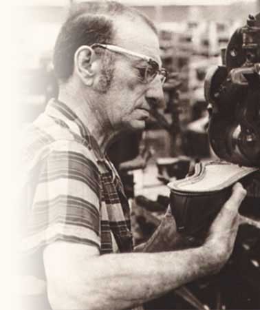 Man restoring a shoe by hand
